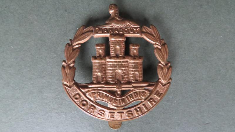 British Army WW1 Economy Issue The Dorsetshire Regiment Cap Badge